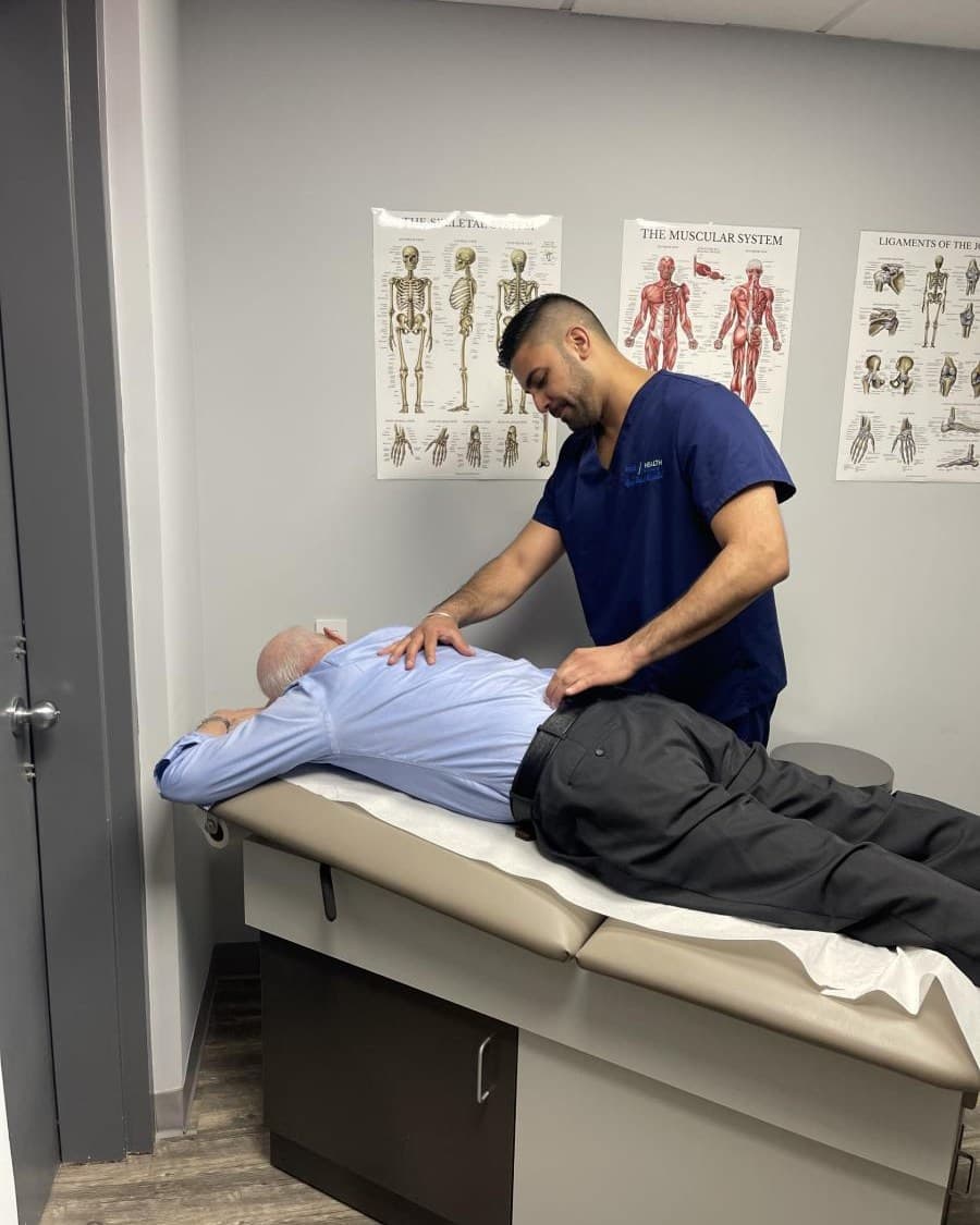 Physician treating lower back